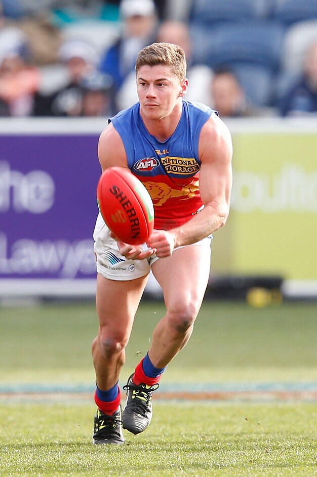 AFL 2015 Rd 18 - Geelong v Brisbane GEELONG, AUSTRALIA - AUGUST 1: Dayne Zorko of the Lions handballs during the 2015 AFL round 18 match between the Geelong Cats and the Brisbane Lions at Simonds Stadium, Geelong, Australia on August 1, 2015. (Photo by Darrian Traynor/AFL Media)